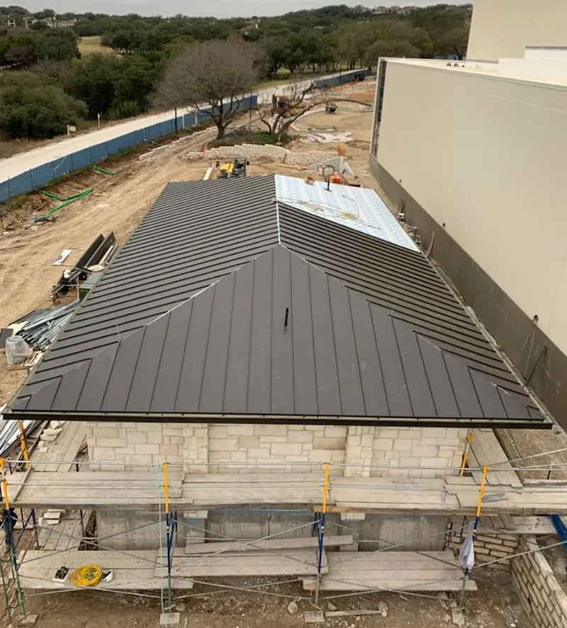 Metal roof new construction with scaffolding in Visalia
