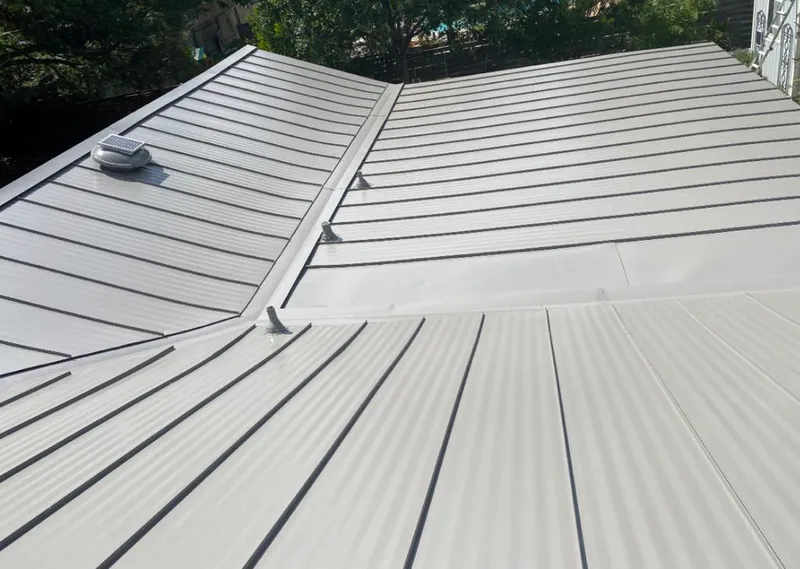 Solar attic fan installed on a metal roof for Roof Ventilation in Visalia